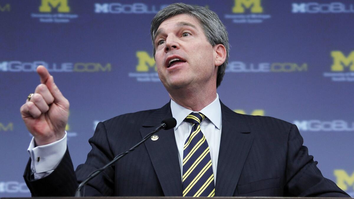 Michigan athletic director Dave Brandon resigned on Friday.