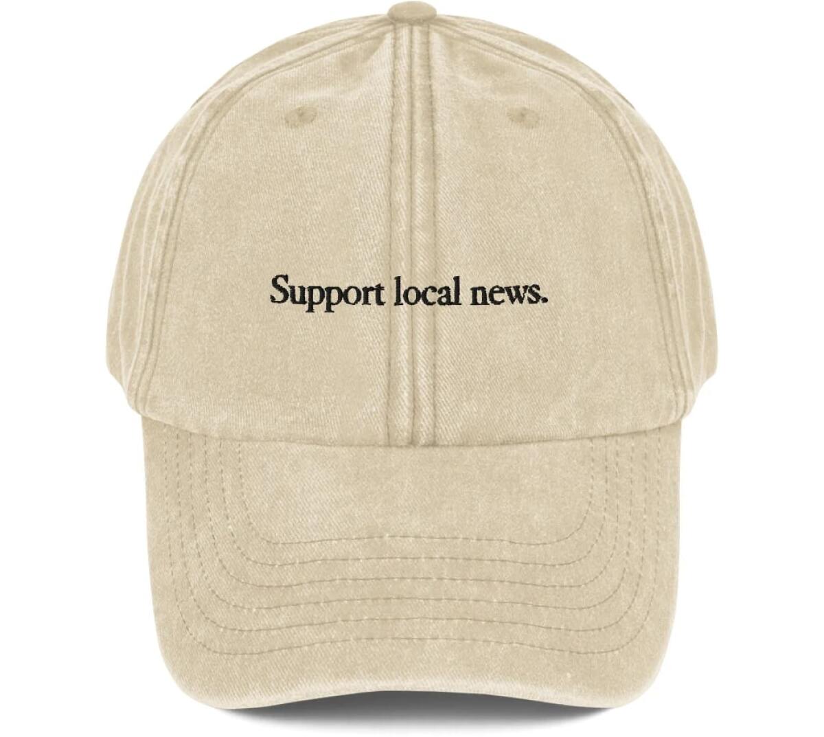 "Support local news" hat.
