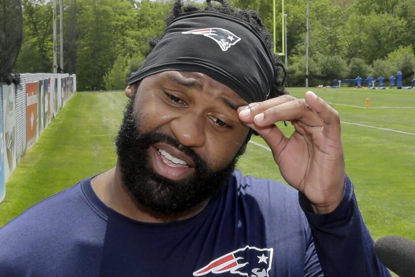 Brandon Spikes talks with reporters after practicing with the New England Patriots in May.