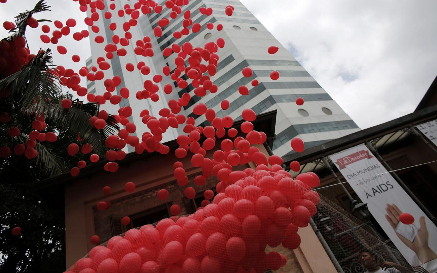 Red balloons are released to mark World Aids Day in Sao Paulo