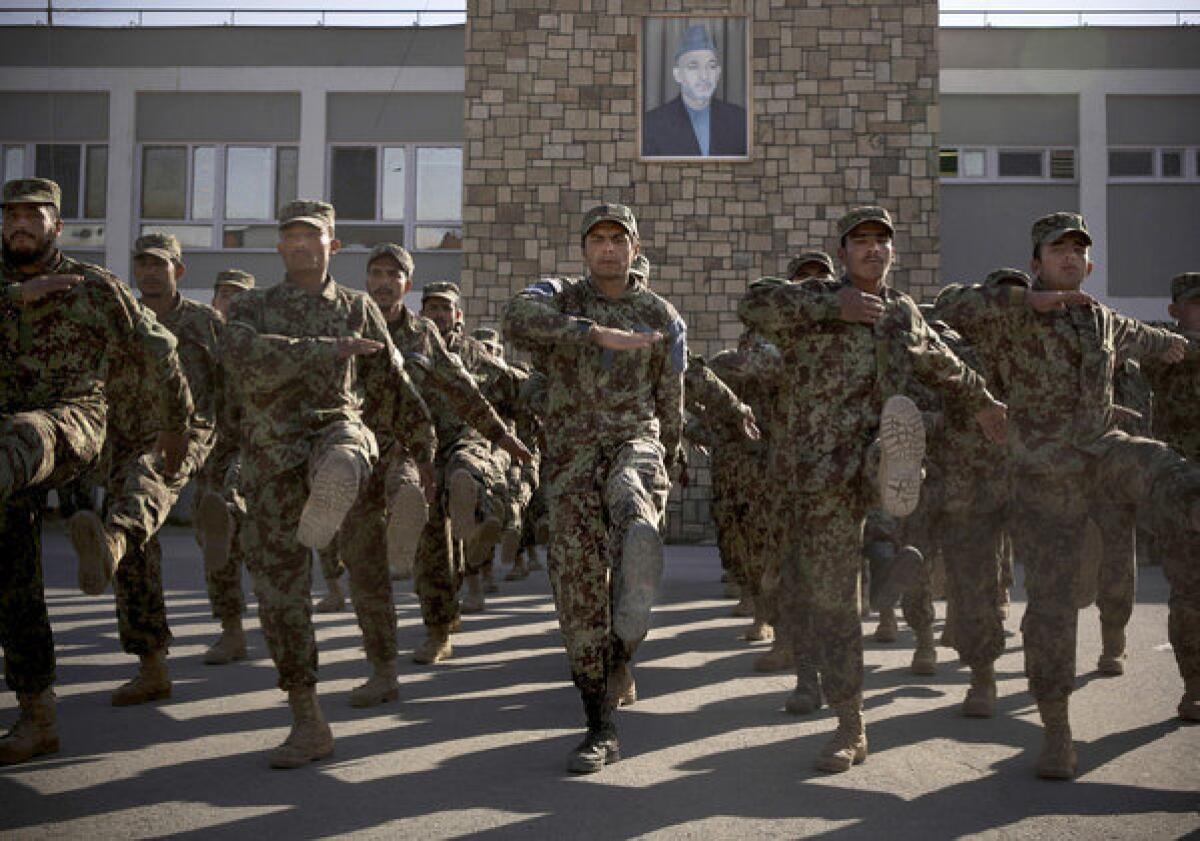 Afghan soldiers exercise at a training facility on the outskirts of Kabul last month.