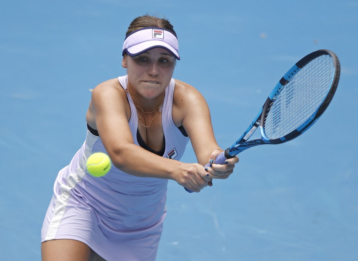 Sofia Kenin makes a backhand return to Kaia Kanepi.