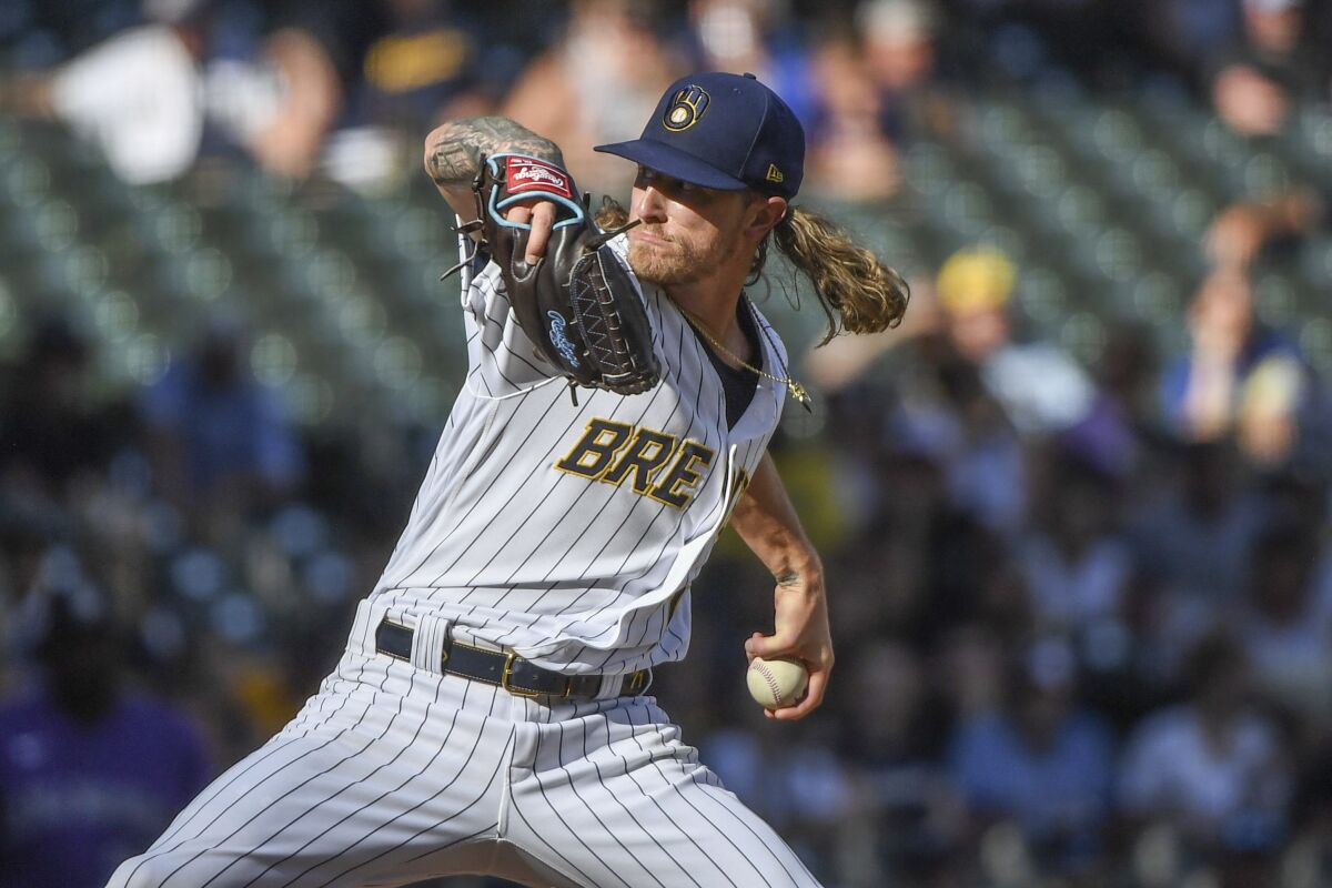 Milwaukee Brewers' Josh Hader pitches during the ninth inning of a baseball game against the Colorado Rockies, Sunday, July 24, 2022, in Milwaukee. (AP Photo/Kenny Yoo)