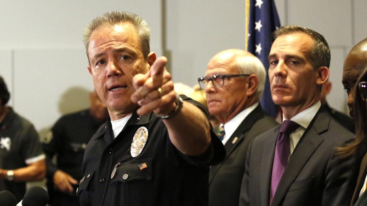 Los Angeles Police Department Chief Michel Moore addresses a news conference at LAPD headquarters.