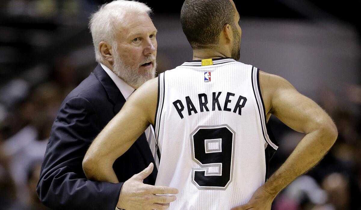 Spurs Coach Gregg Popovich, a five-time NBA champion, talks strategy with point guard Tony Parker, a four-time champion and 2007 NBA Finals MVP.