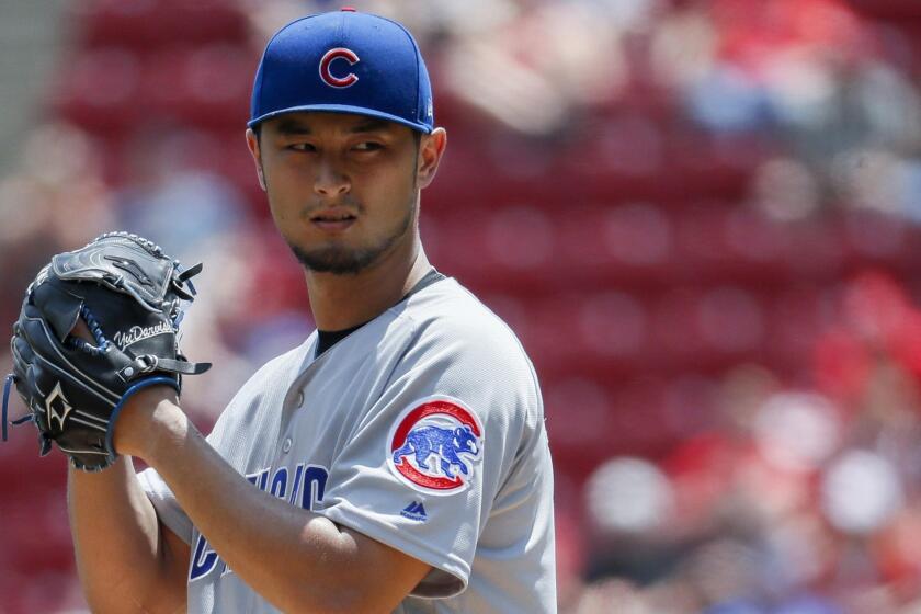 Chicago Cubs starting pitcher Yu Darvish prepares to throw in the second inning of a baseball game against the Cincinnati Reds, Sunday, May 20, 2018, in Cincinnati. (AP Photo/John Minchillo)