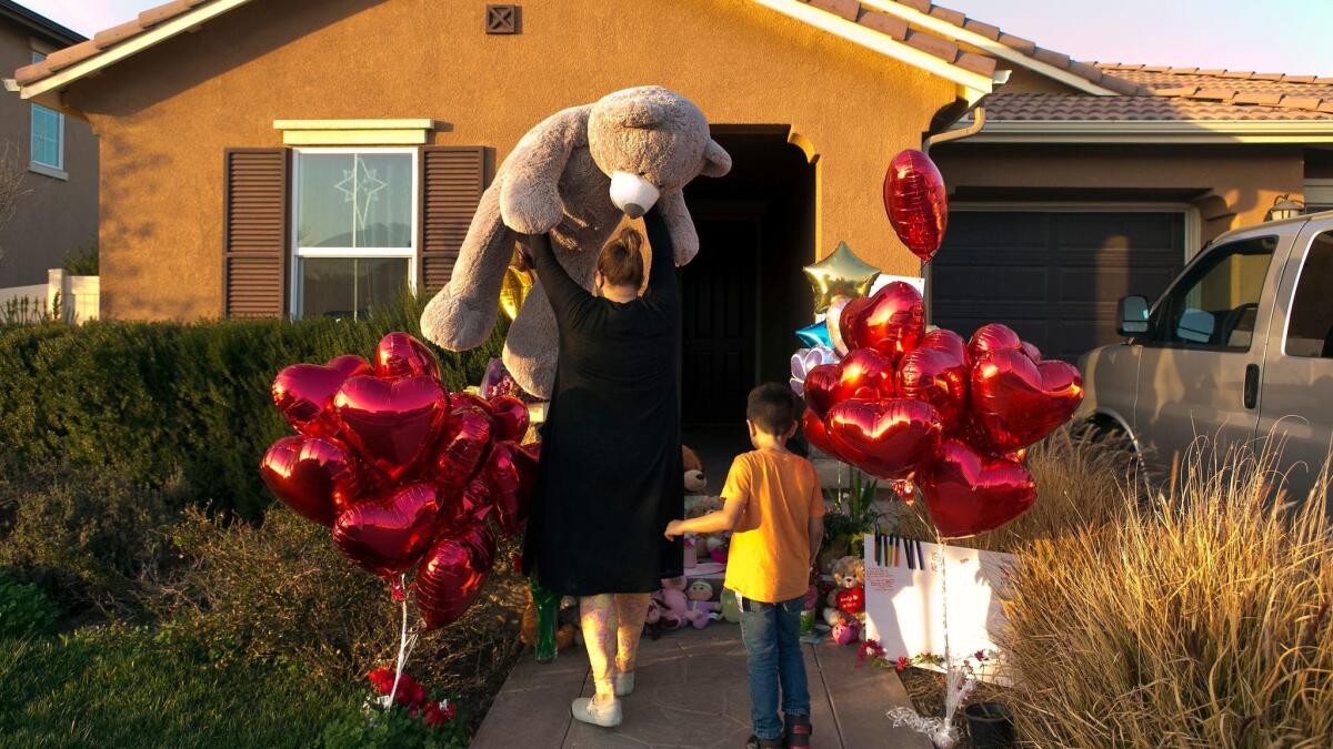 Neighbors of the Turpin family on Jan. 18 drop off a gift at the home of the 13 children who were allegedly abused and neglected by their parents.