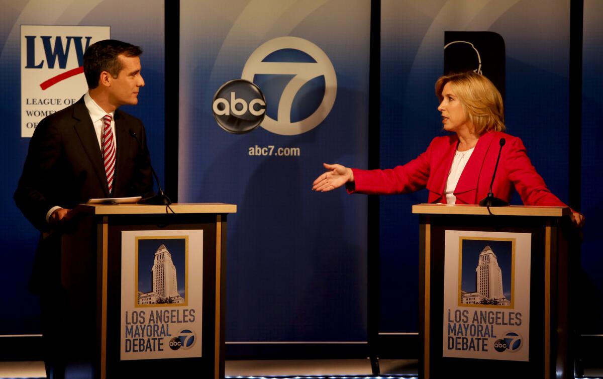 Mayoral candidates Eric Garcetti and Wendy Greuel. DWP compensation has become a central issue in the May 21 election.
