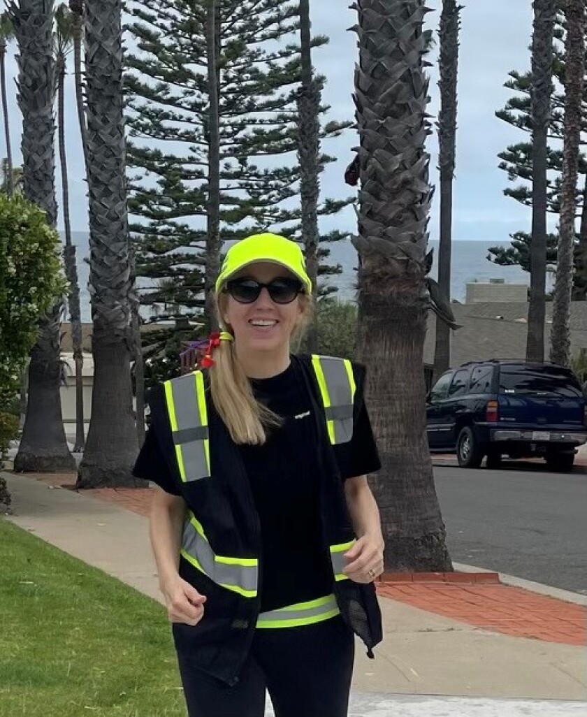 La Jolla resident Laurie Block models some of the reflective gear she gives away at the La Jolla Open Aire Market.