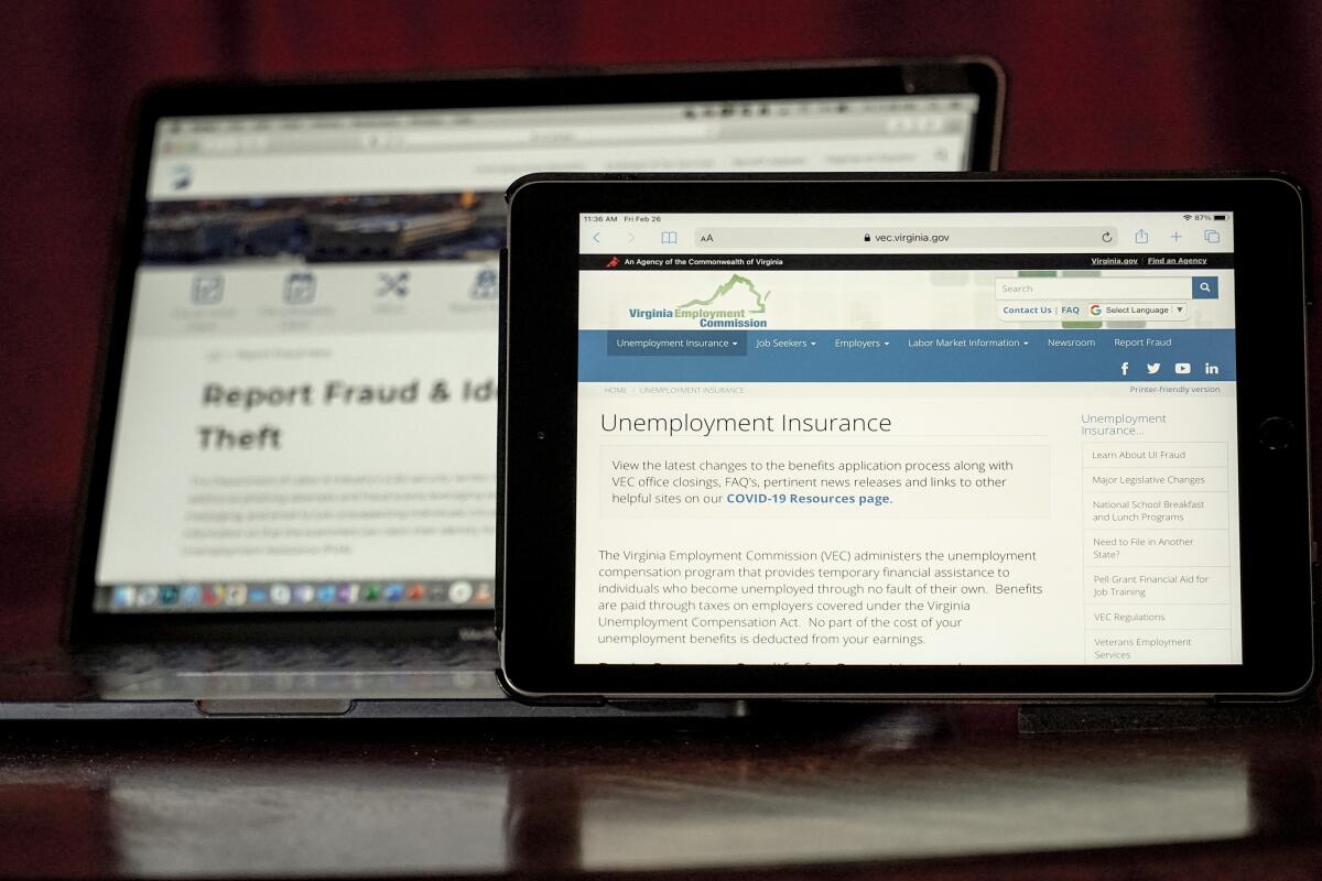 Computer screens are open to two state government pages on unemployment insurance and fraud.