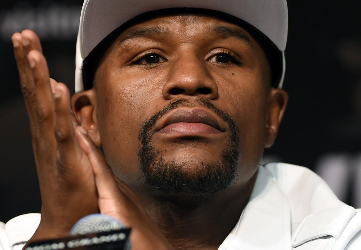 Welterweight champion Floyd Mayweather Jr. answers questions at a news conference Wednesday ahead of his title fight on Saturday with Marcos Maidana in Las Vegas.