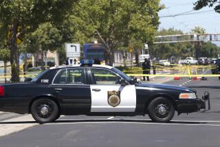 Crime scene tape surrounds the area as Sacramento Police officers investigate the fatal shooting of a knife-waving suspect by police, Monday, July 11, 2016, in Sacramento, Calif. Police were called to the area by witnesses who reported a man walking down the street waving a knife over his head, and that he had a gun in his waistband. When confronted by officers the man allegedly turned toward them with the knife and was shot by police. (AP Photo/Rich Pedroncelli)