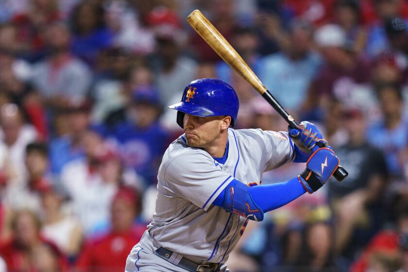 FILE - New York Mets' Brandon Nimmo bats during the second baseball game of the team's doubleheader against the Philadelphia Phillies, Aug. 20, 2022, in Philadelphia. Nimmo is staying with the free-spending Mets, agreeing to a $162 million, eight-year contract, according to a person familiar with the deal. The person spoke to The Associated Press on condition of anonymity Thursday night because the agreement is subject to a successful physical and no announcement had been made. (AP Photo/Chris Szagola, File)