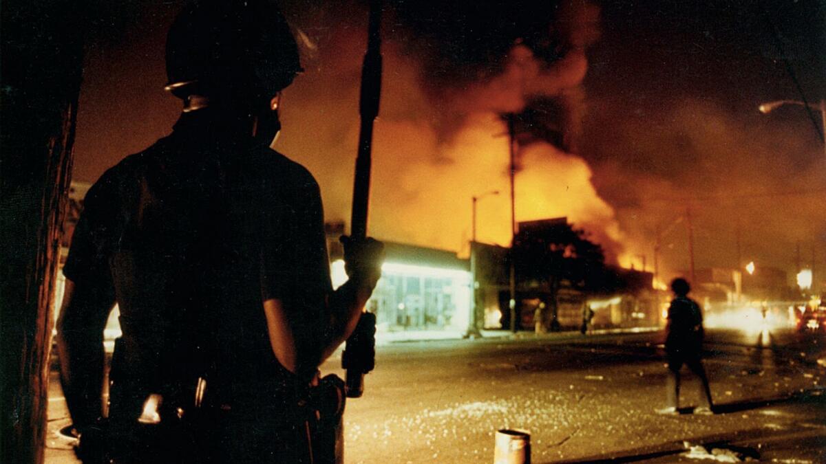 LAPD officer Delwin Fields guards the intersection at Central and 46th Street on April 30, 1992.