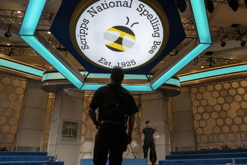 Crew members assemble the main stage ahead of the 2023 Scripps Nations Spelling Bee on Sunday, May 28, 2023, at National Harbor in Oxon Hill, Md. (AP Photo/Nathan Howard)