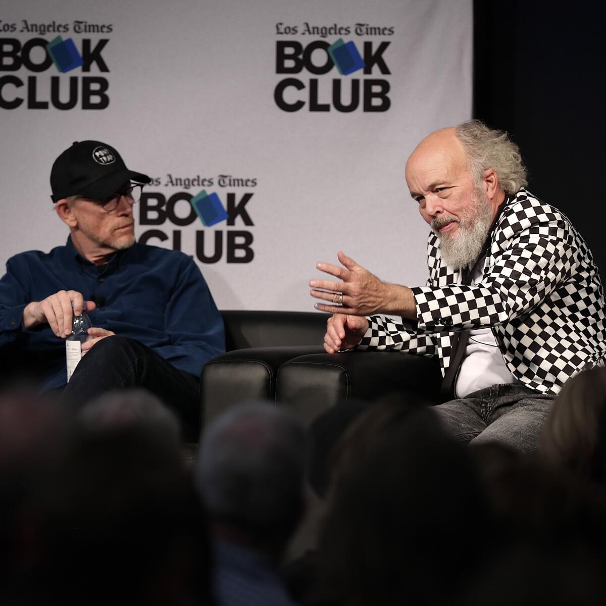 Ron Howard listens as Clint Howard speaks.