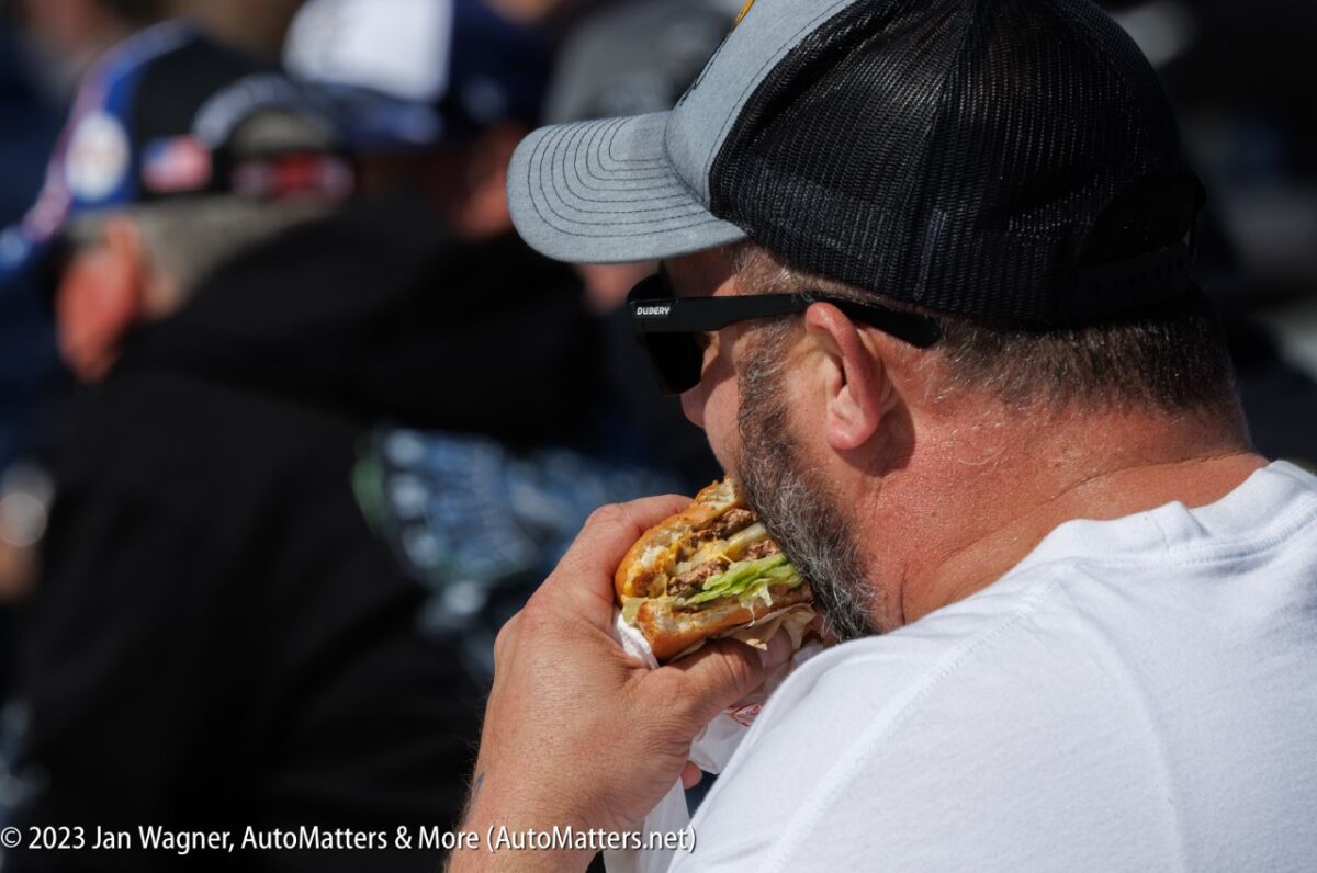 Enjoying an In-N-Out burger in the grandstands.