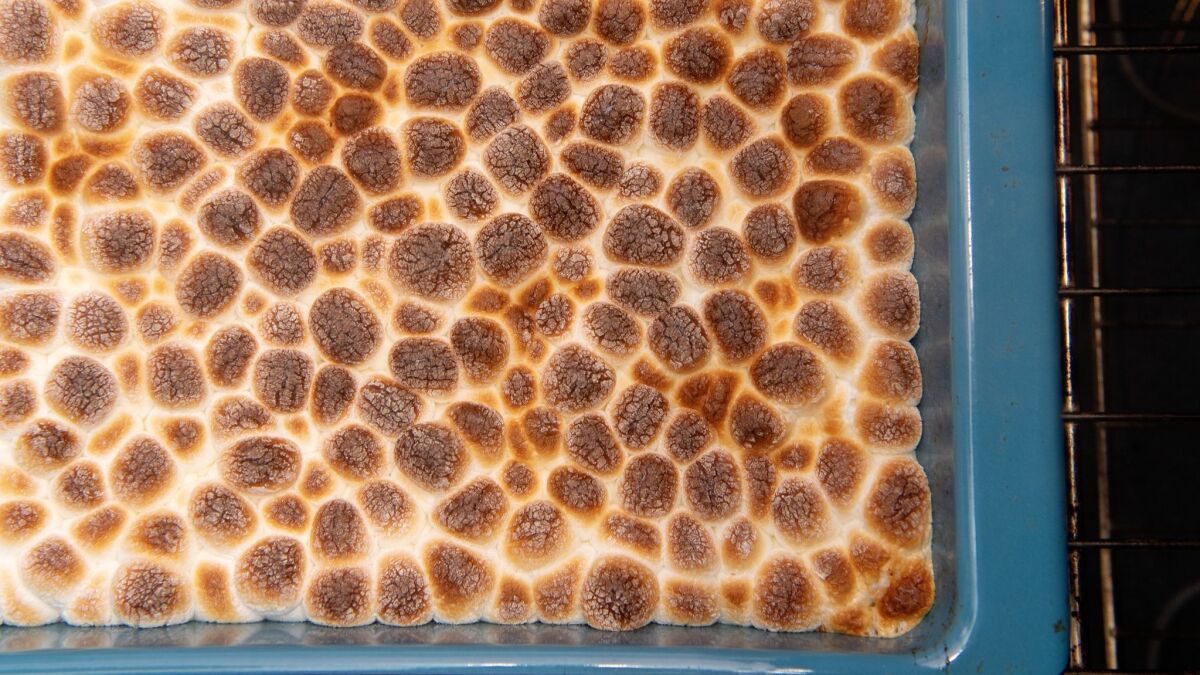 Pull the pan out of the oven right when the marshmallows are puffed and nearly charred.