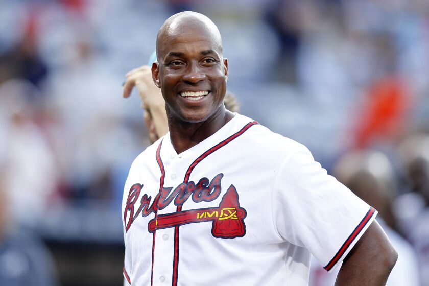 FILE - Former Atlanta Braves first baseman Fred McGriff smiles on the field before a baseball game against the Miami Marlins, Friday, Aug. 7, 2015, in Atlanta. Barry Bonds, Roger Clemens and Curt Schilling were passed over by a Baseball Hall of Fame committee that elected former big league slugger Fred McGriff to Cooperstown on Sunday, Dec. 4, 2022. (AP Photo/Brett Davis, File)
