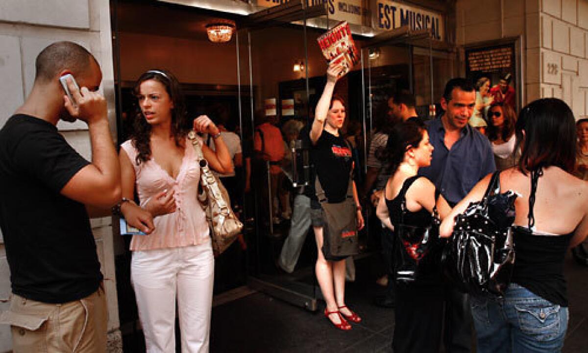 YOUNGER CROWD: Attendees wait to enter the Richard Rodgers Theatre where the Tony-nominated hip-hop musical "In the Heights" is playing to packed houses.