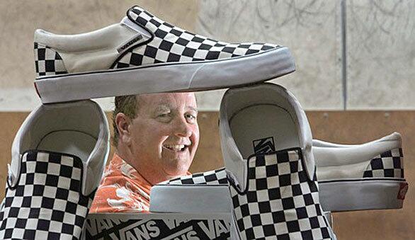 Steve Van Doren appears to be framed by the Vans shoes whose famous checkerboard design was created by his father, company founder Paul Van Doren. This particular shoe style is No 98, a.k.a. the "Classic Slip-On." The history of the Vans company, which was once a family owned business but is now a part of North Carolina-based apparel maker VF Corp., is chronicled in "Vans: Off the Wall: Stories of Sole From Vans Originals," by Doug Palladini. The book is due out June 4. More in Image: • Neon fashions turn it up for summer | Photos • Vans shoes: a happily checkered past | Photos • Lookback: Robin Piccone and Body Glove: When the beach arrived | Past Lookbacks • Clemente siblings: good taste times four • Pictures: Get the sun-kissed look for summer • Weekly obsessions: Memorial Day barbecue essentials • The Image Photo Booth: Grace Slick's White Rabbit Art and Tea Party • All the Rage: The Image section's blog