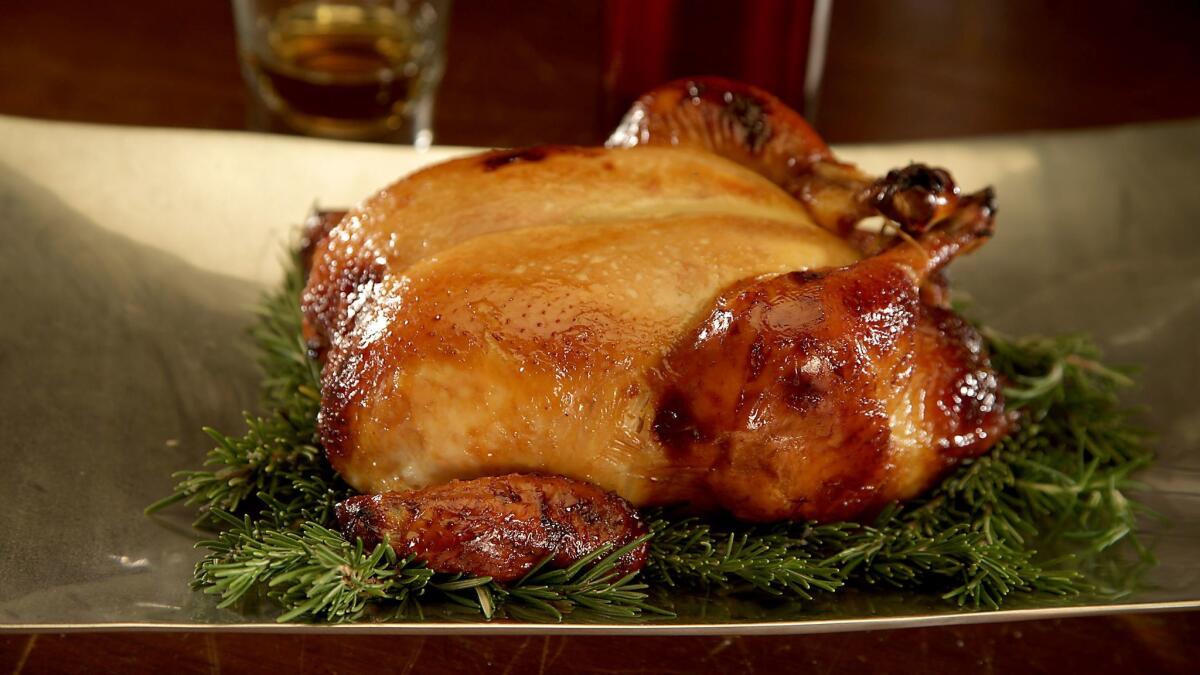 Distilled liquors such as bourbon can enhance the flavor of food, like this honey-bourbon roast chicken.