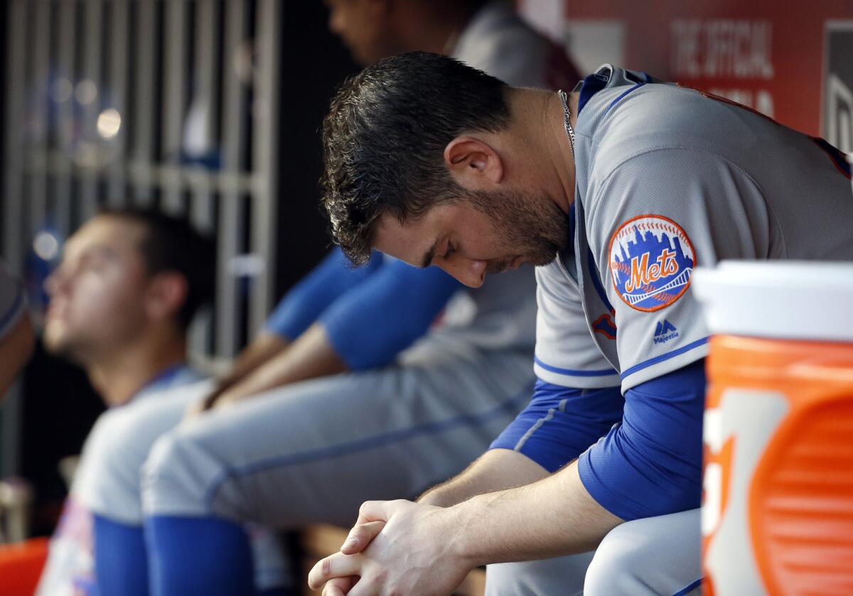 New York Mets pitcher Matt Harvey sits in the dugout during the fourth inning of a game against Washington on Tuesday.