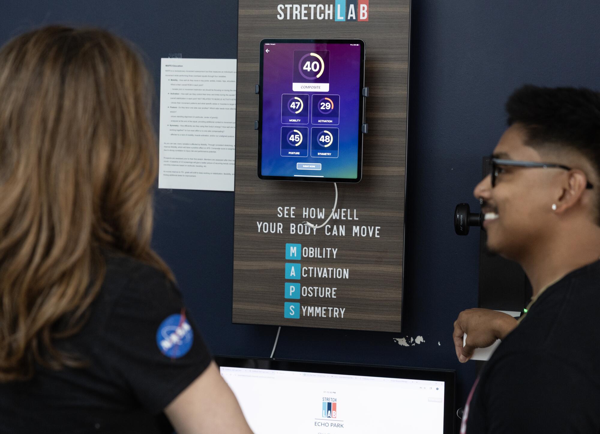 What is a 'flexologist' — and do you need to see one? 6 A man and woman shown from behind looking at assessment scores on an iPad.