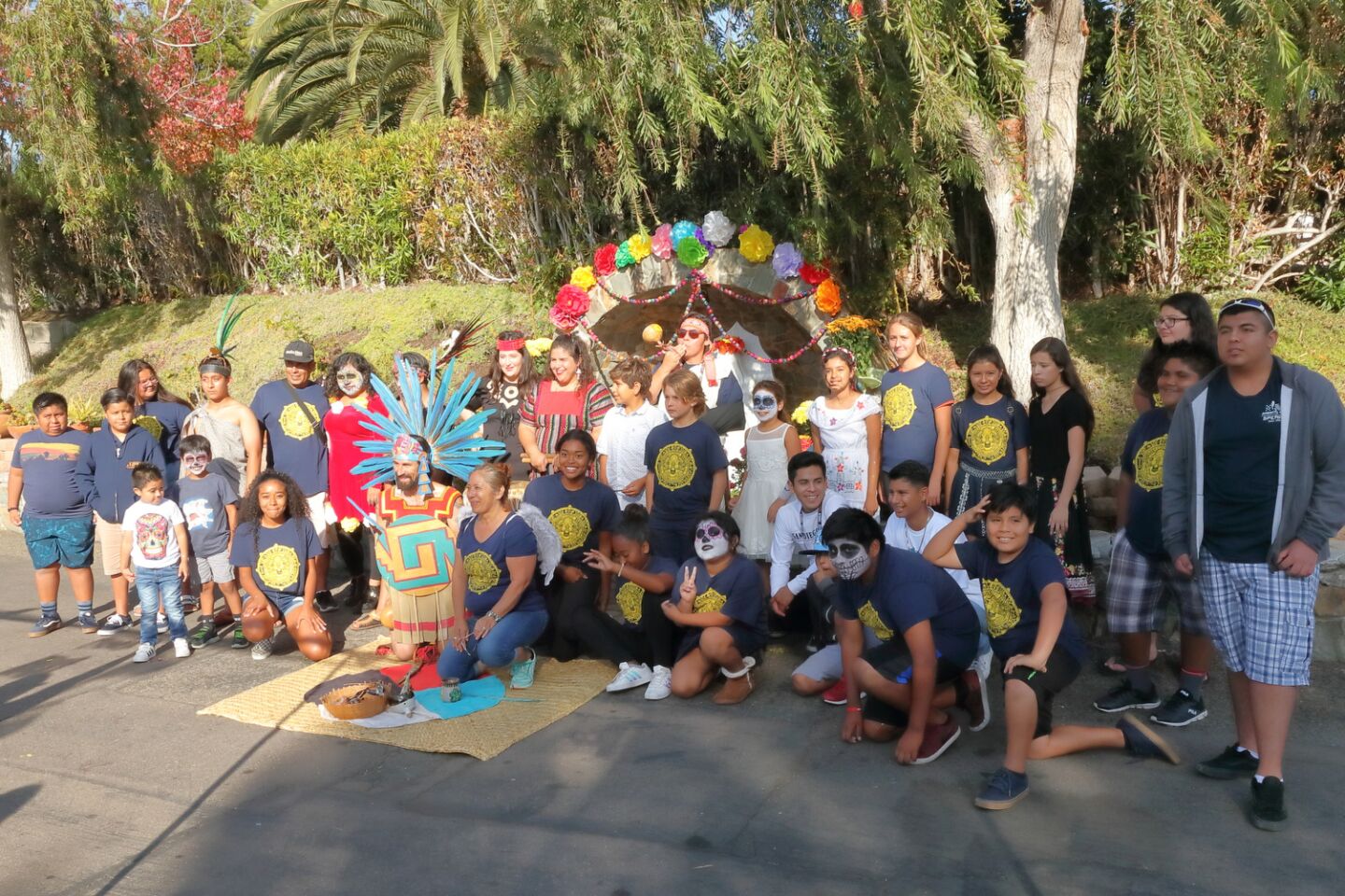 The traditional Aztec dance group Calpulli Omeyocan and local residents gather to celebrate the 10th anniversary of La Clase Mgica after school program