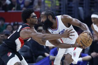 Los Angeles, CA - December 11: LA Clippers guard James Harden, #1 maneuvers the ball under pressure.