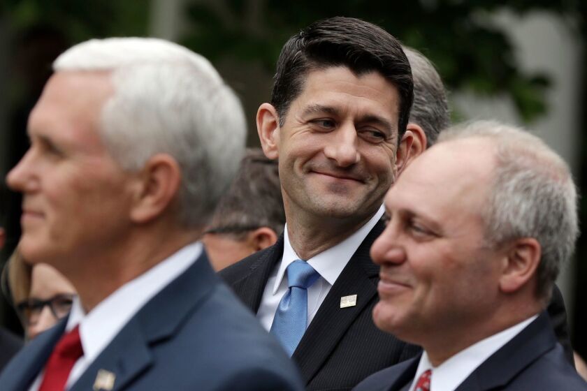 House Speaker Paul Ryan of Wis., flanked by Vice President Mike Pence and House Majority Whip Steve Scalise of La. are seen in the Rose Garden of the White House in Washington, Thursday, May 4, 2017, after the House pushed through a health care bill. (AP Photo/Evan Vucci)