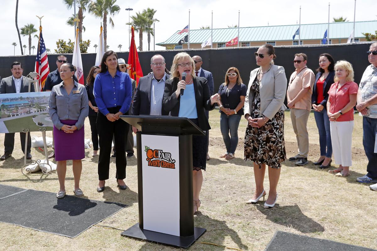Costa Mesa Mayor Katrina Foley speaks during a groundbreaking ceremony Thursday for the new location of an A-4 Skyhawk attack aircraft at Heroes Hall at the Orange County fairgrounds.