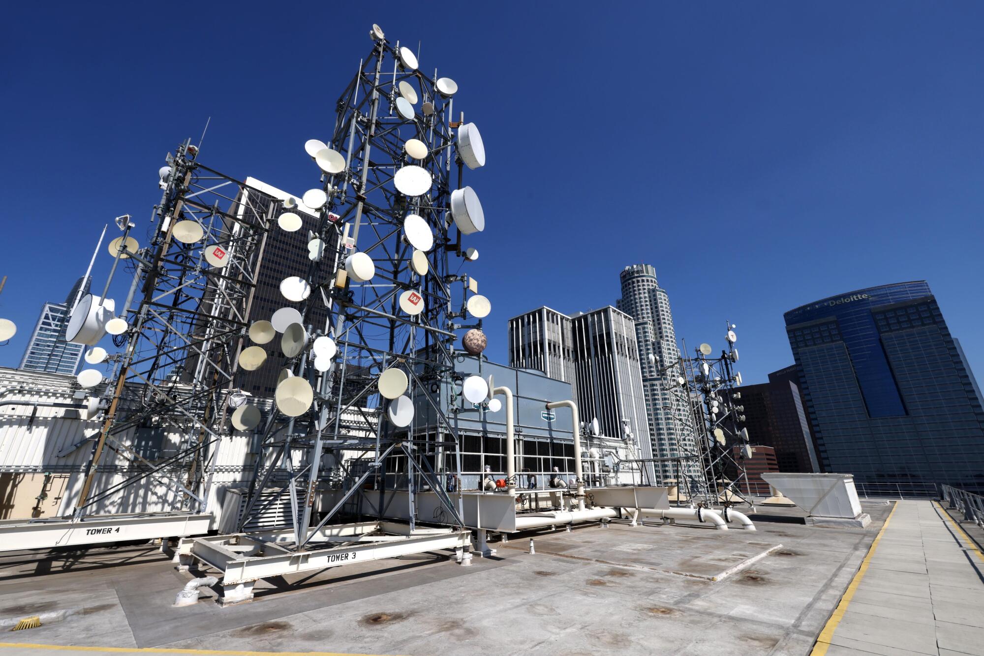 A worker makes his way through the equipment yard at One Wilshire in downtown Los Angeles.