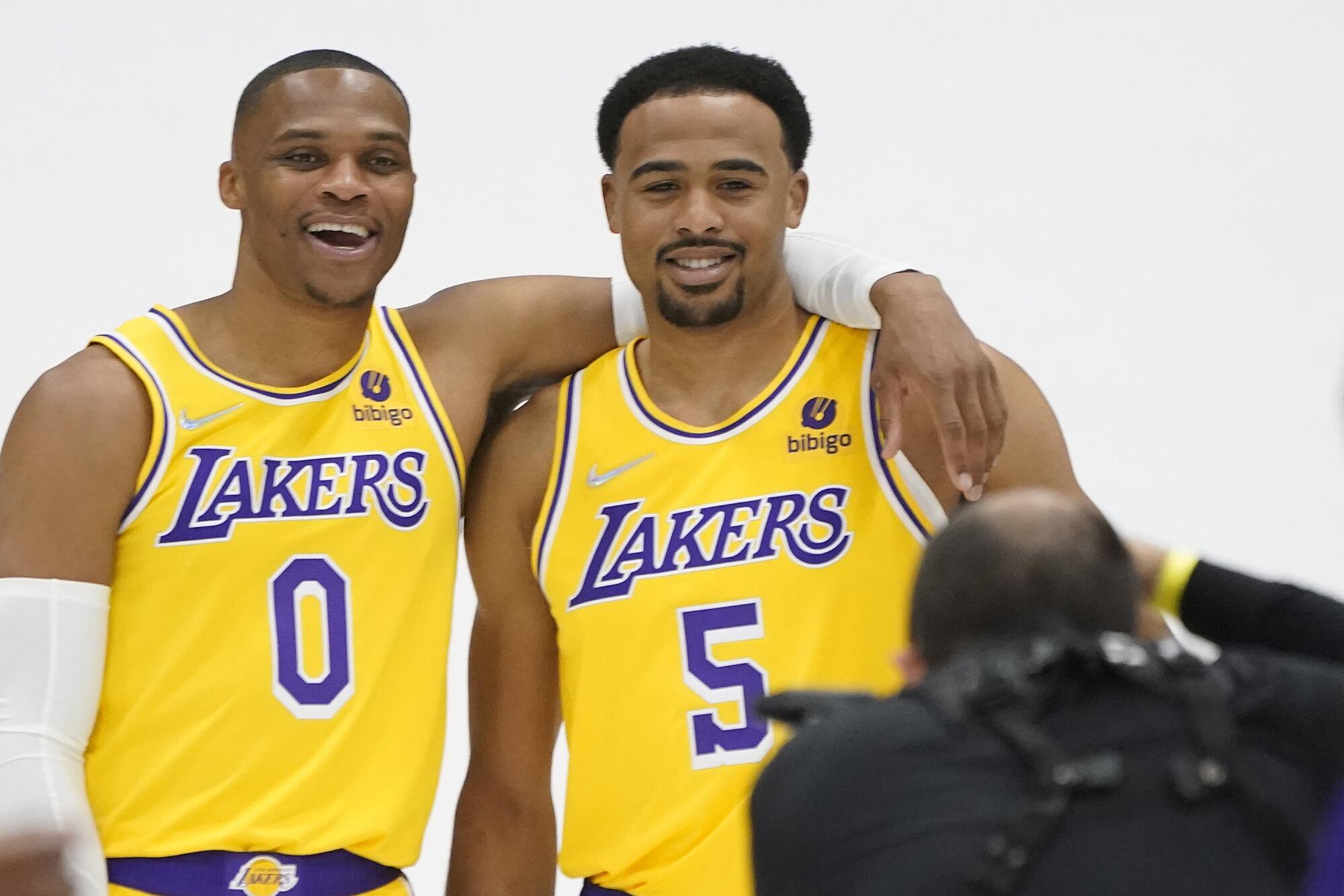 Los Angeles Lakers guard Russell Westbrook, left, takes a photo with Talen Horton-Tucker (5).