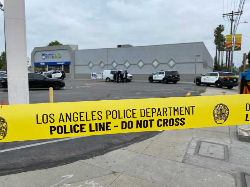 Yellow tape that says Los Angeles Police Department, Police Line - Do Not Cross