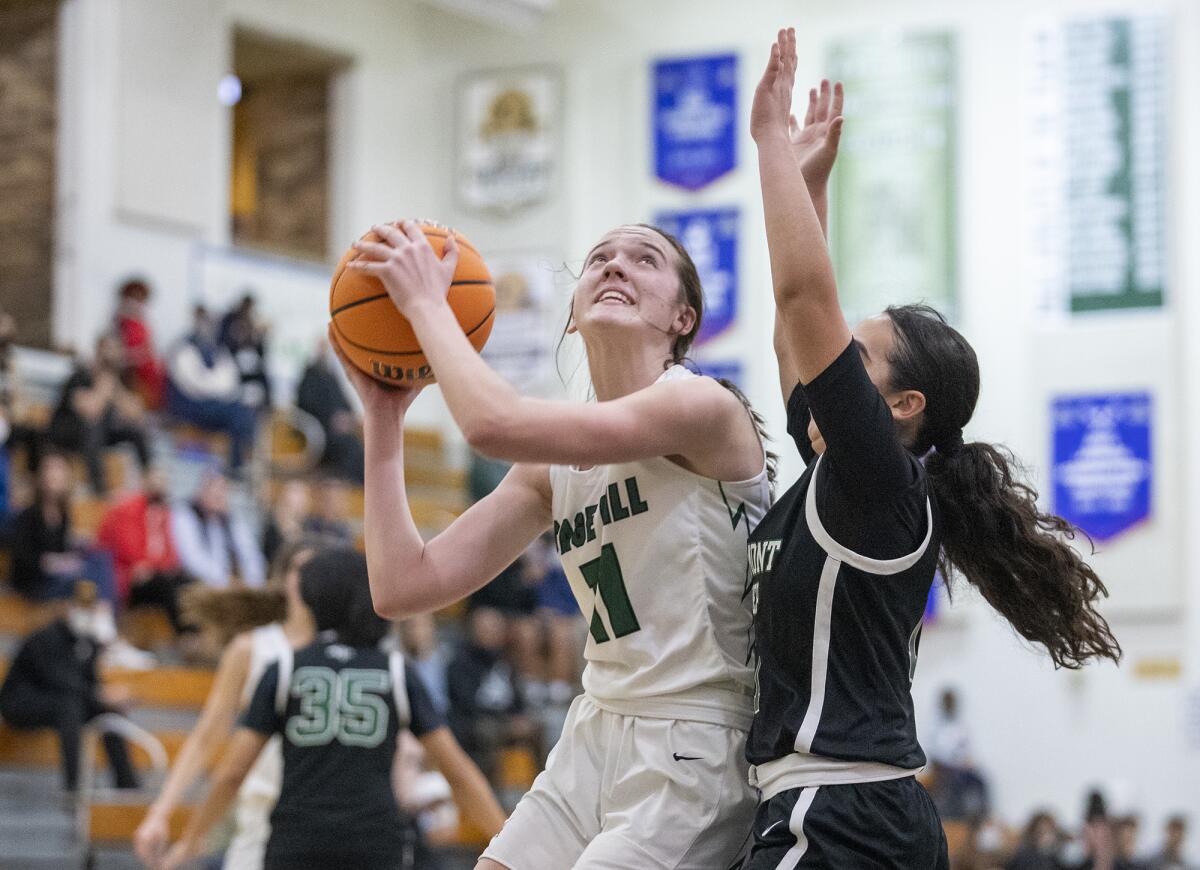 Sage Hill's Kat Righeimer goes up for a shot against Fairmont Prep's Jaila Pineda in a San Joaquin League game on Thursday.