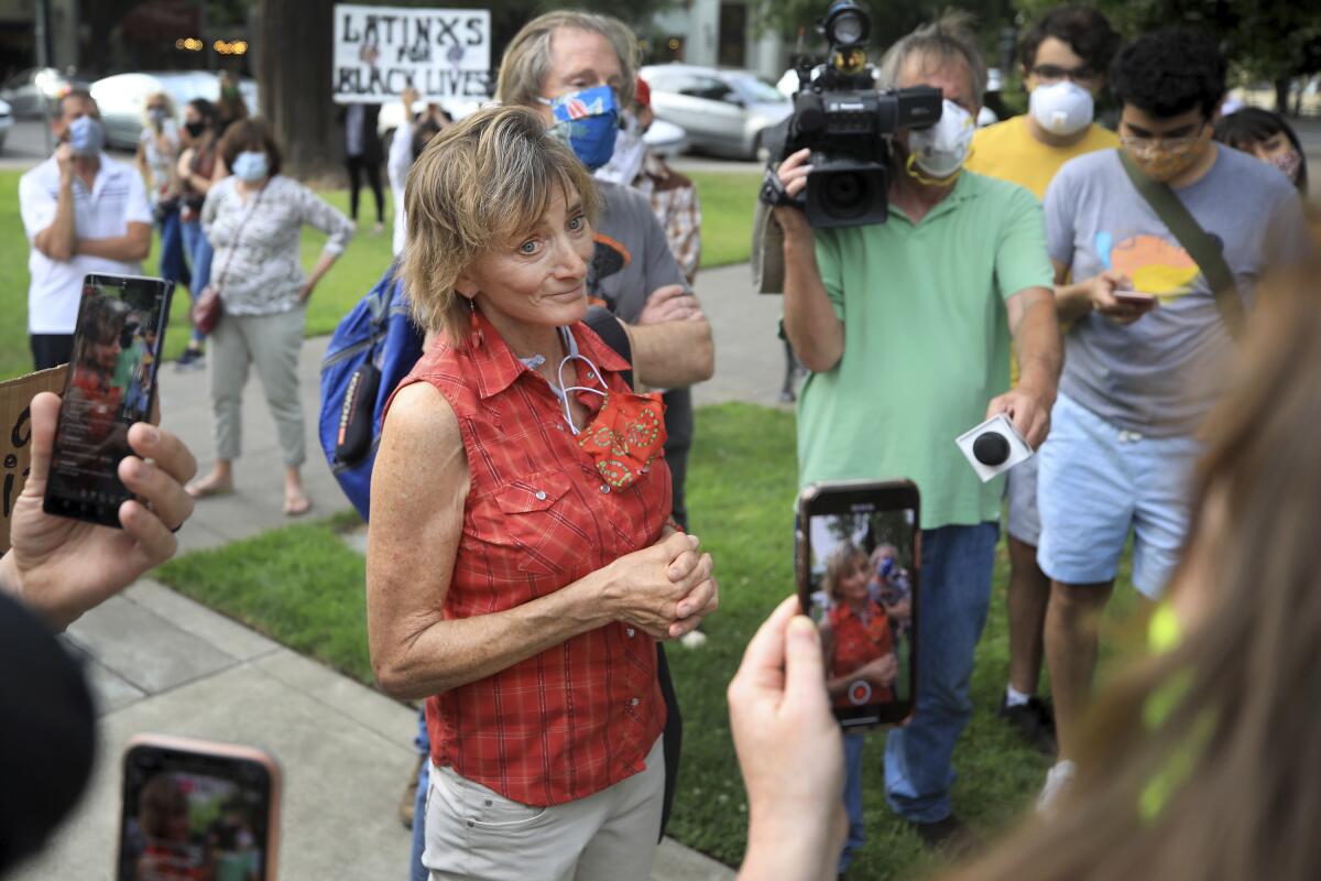 Healdsburg Mayor Leah Gold gets into a pointed exchange with protesters on June 11. 