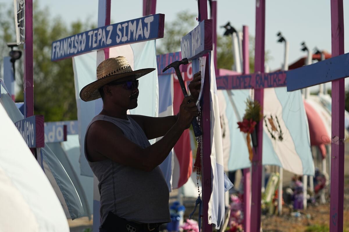 Makeshift memorial where dozens of migrants were found dead in a tractor-trailer in San Antonio