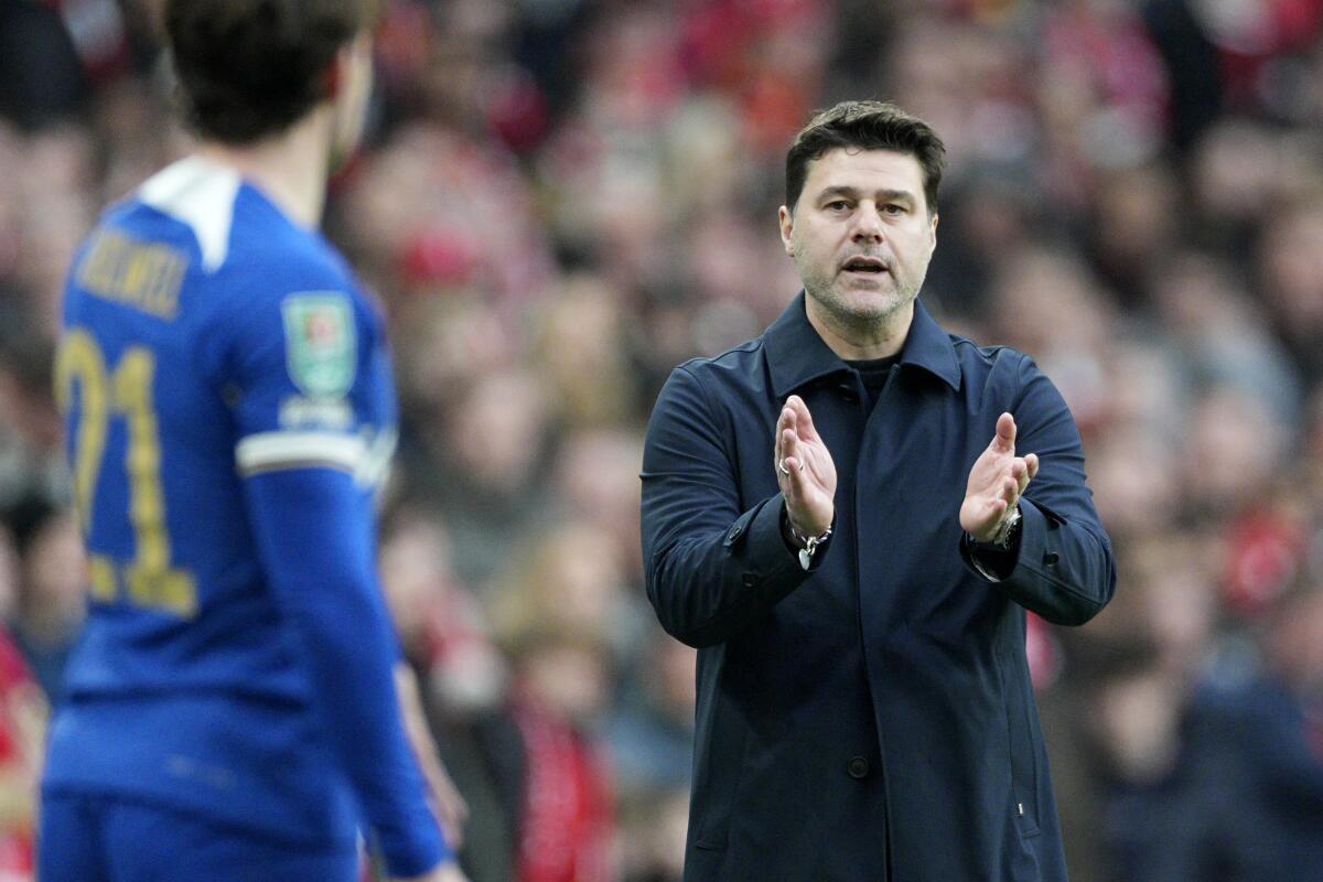 Chelsea coach Mauricio Pochettino gives instructions from the sideline during a match against Liverpool