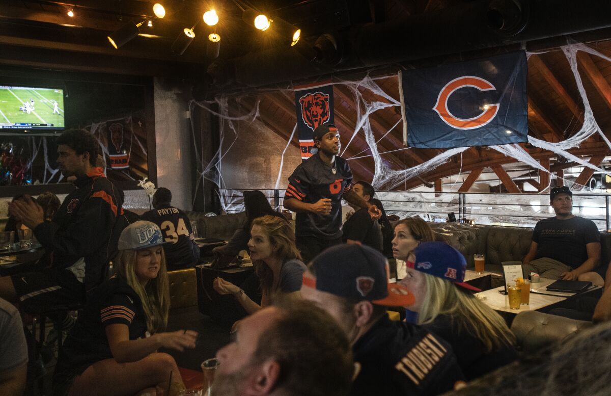Chicago Bears fans gather in the clubby upstairs lounge at Rush Street.