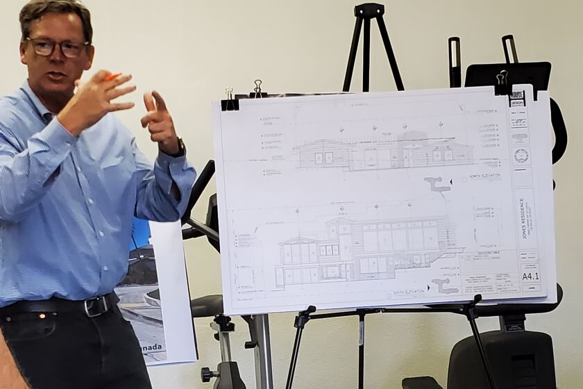 Applicant representative Mark House shows plans to renovate a house at 5960 Camino de la Costa.