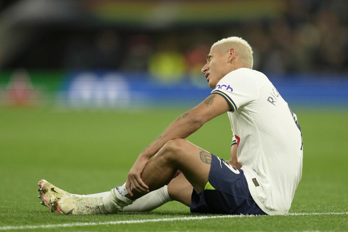Tottenham's Richarlison sits down on the pitch during the English Premier League soccer match between Tottenham Hotspur and Everton at the Tottenham Hotspur Stadium in London, England, Saturday, Oct. 15, 2022. (AP Photo/Kin Cheung)