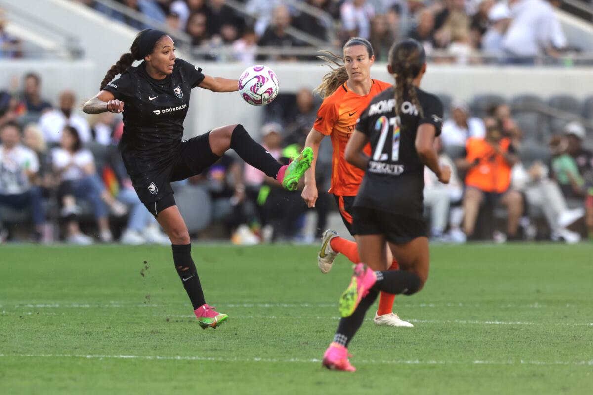 LAFC's Sydney Leroux, left, controls the ball in front of Houston's Katie Lind during the second half of 0-0 draw.