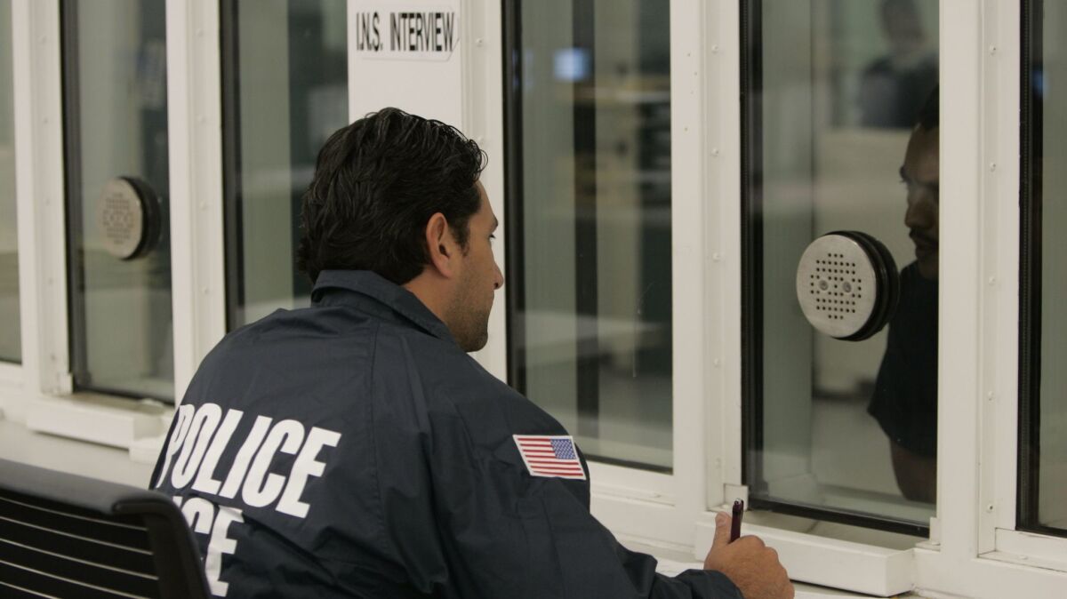 ICE officers interrogate newly admitted prisoners at the downtown San Diego Central Jail