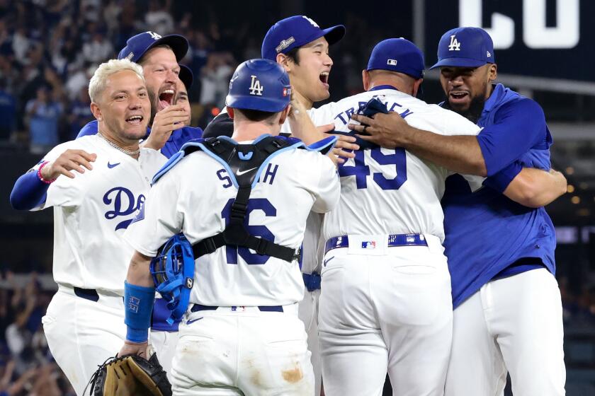 LOS ANGELES, CALIFORNIA - OCTOBER 11: Blake Treinen #49 of the Los Angeles Dodgers celebrates.