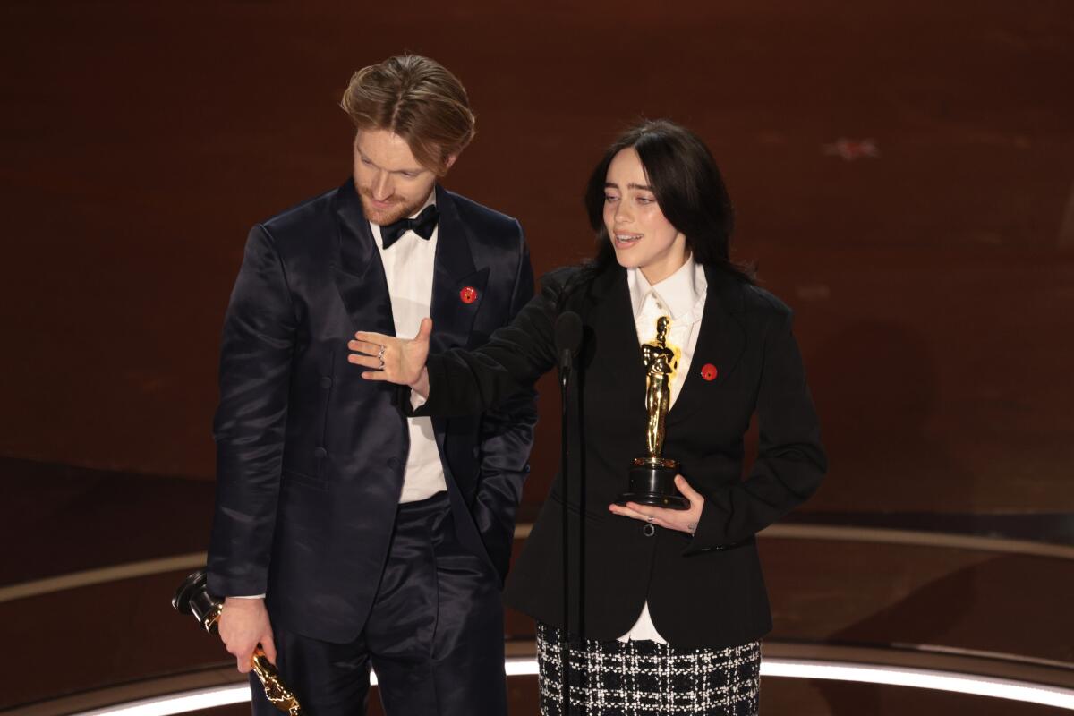 Finneas O'Connell and Billie Eilish accept the Oscar for original song. 