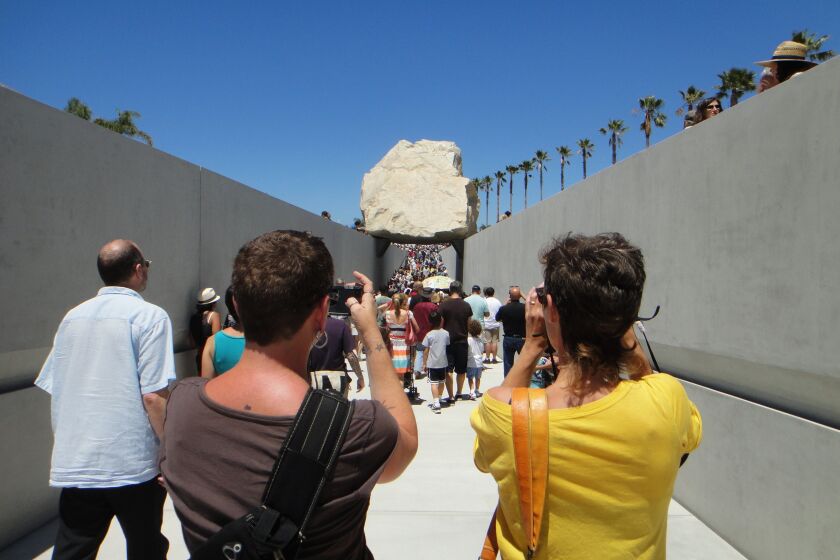 [June 24, 2012] Onlookers photograph Michael Heizer's "Levitated Mass" at LACMA as the installation was opened to the public for the first time in June 2012.