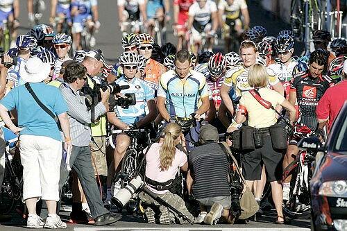 Members of the media surround Lance Armstrong and other riders on Sunday in Adelaide, Australia, before the start of the Cancer Council Classic, a prelude to the Tour Down Under.