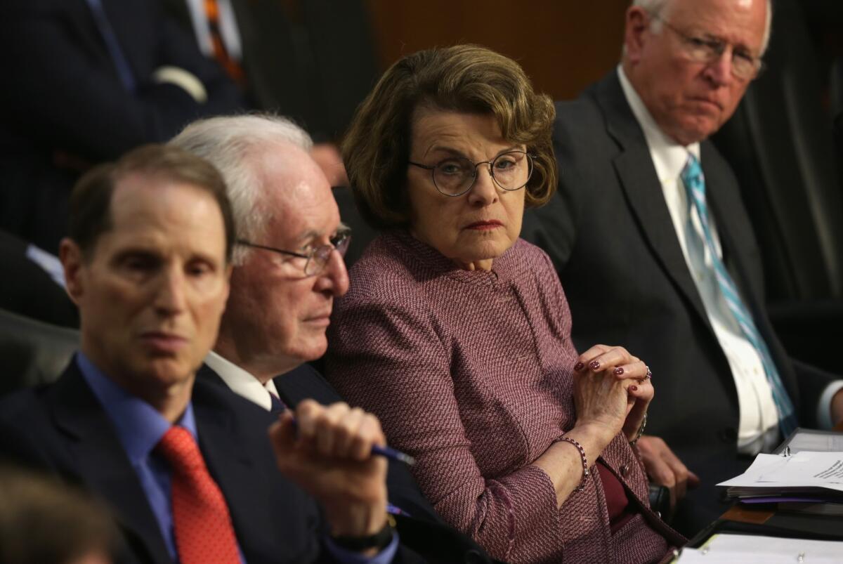 Sen. Dianne Feinstein and other members of the Senate Intelligence Committee at a June hearing. Feinstein, the committee's chairwoman, had angrily denounced CIA actions in March.