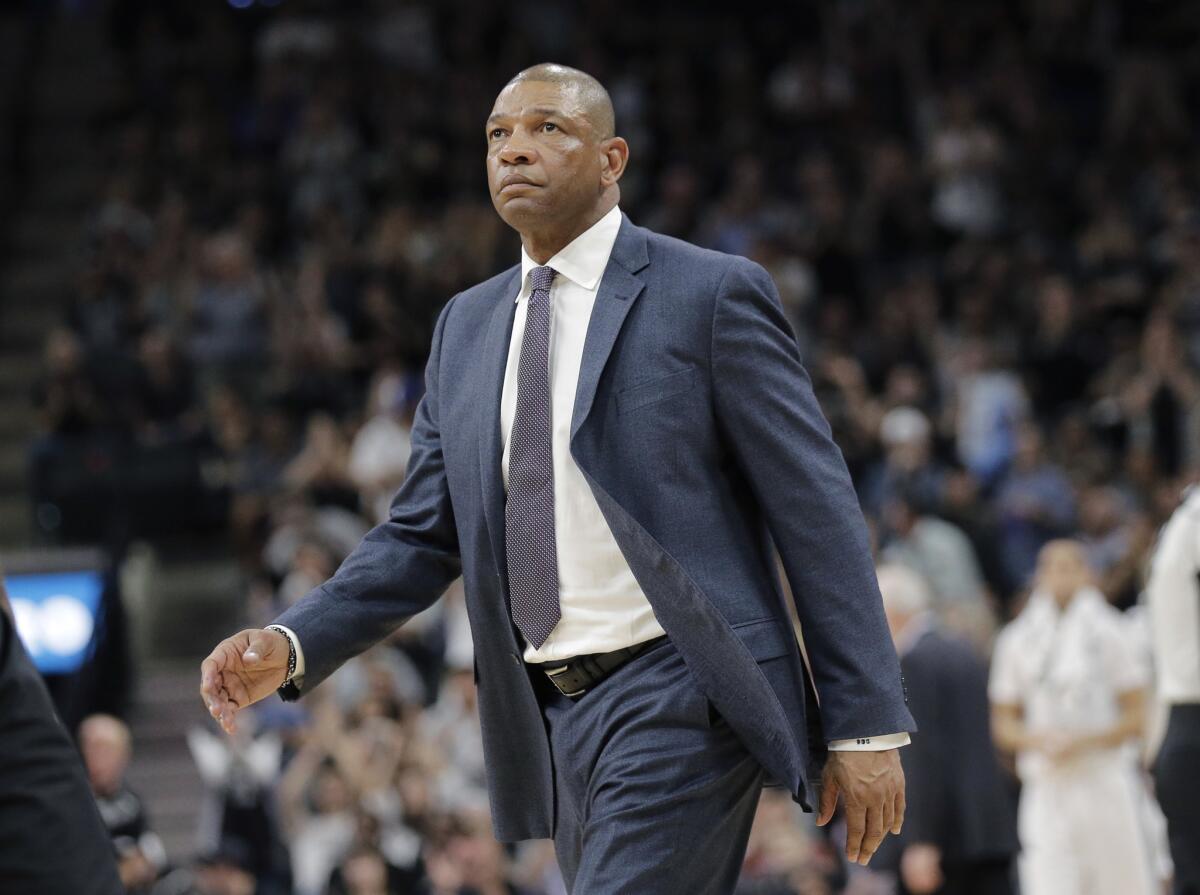Clippers Coach Doc Rivers keeps watch over his team during the first half.